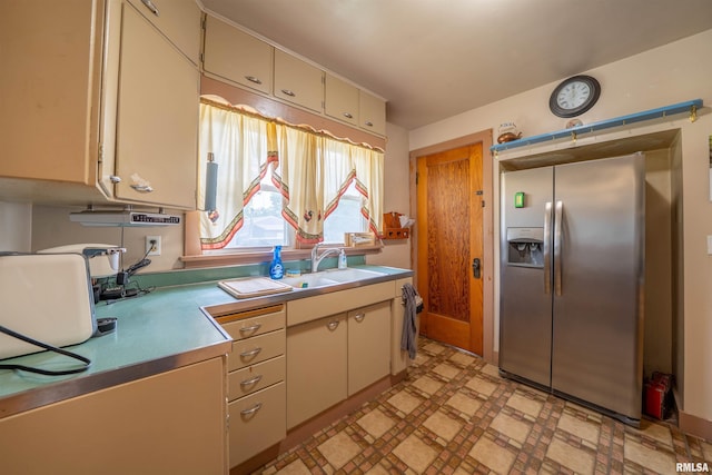 602 W Adams St, Abingdon, IL 61410 - kitchen featuring stainless steel fridge with ice dispenser, a sink, cream cabinets, light floors, and light countertops