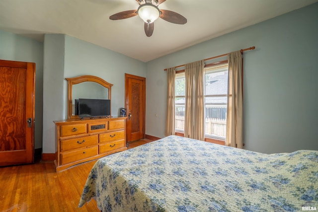 602 W Adams St, Abingdon, IL 61410 - bedroom with wood finished floors, baseboards, and ceiling fan
