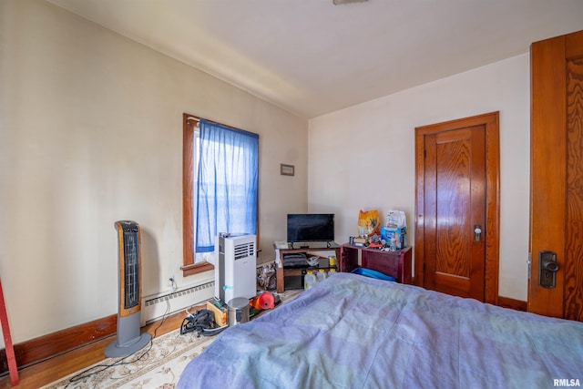 602 W Adams St, Abingdon, IL 61410 - bedroom with a baseboard heating unit