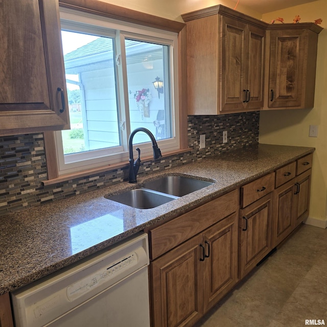 4928 W Farmington Rd, Peoria, IL 61604 - kitchen featuring white dishwasher, a sink, decorative backsplash, and healthy amount of natural light