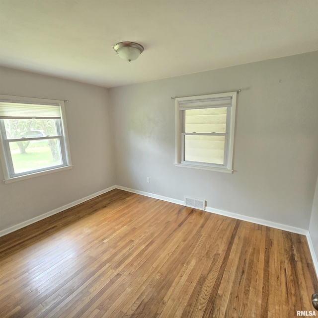 4928 W Farmington Rd, Peoria, IL 61604 - unfurnished room featuring light wood-style floors and baseboards
