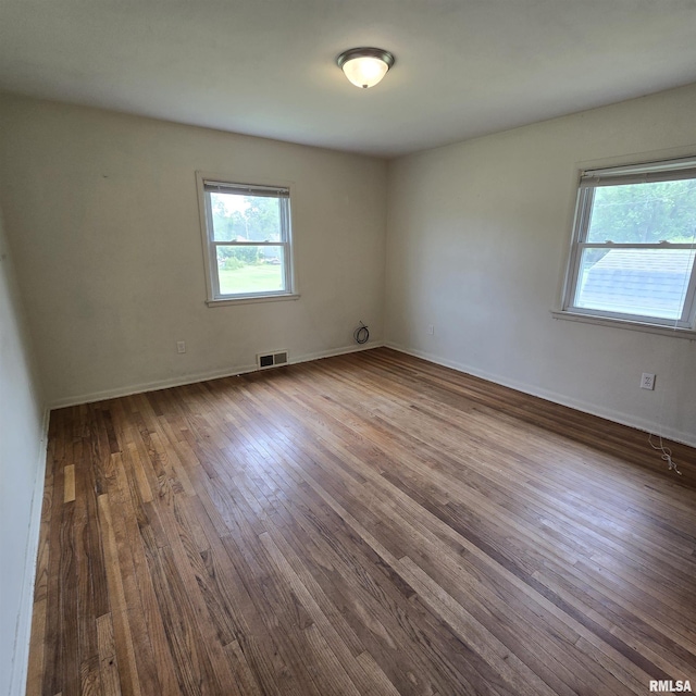 4928 W Farmington Rd, Peoria, IL 61604 - empty room with wood finished floors and baseboards