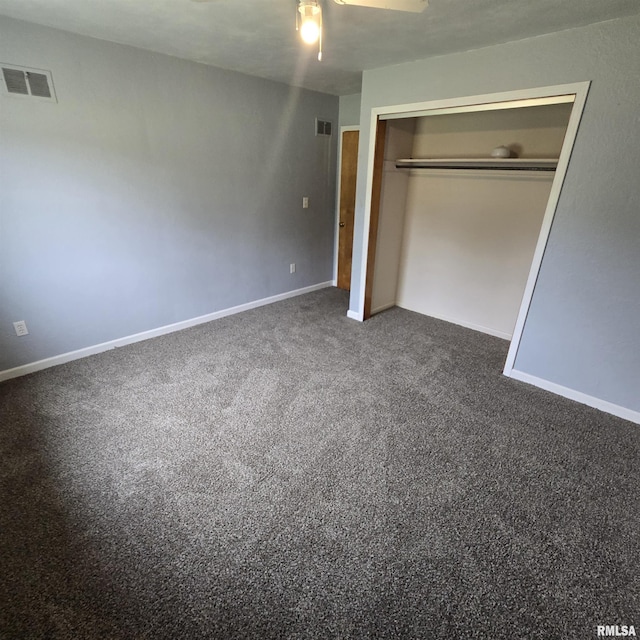 4928 W Farmington Rd, Peoria, IL 61604 - unfurnished bedroom with dark colored carpet, a closet, baseboards, and a ceiling fan