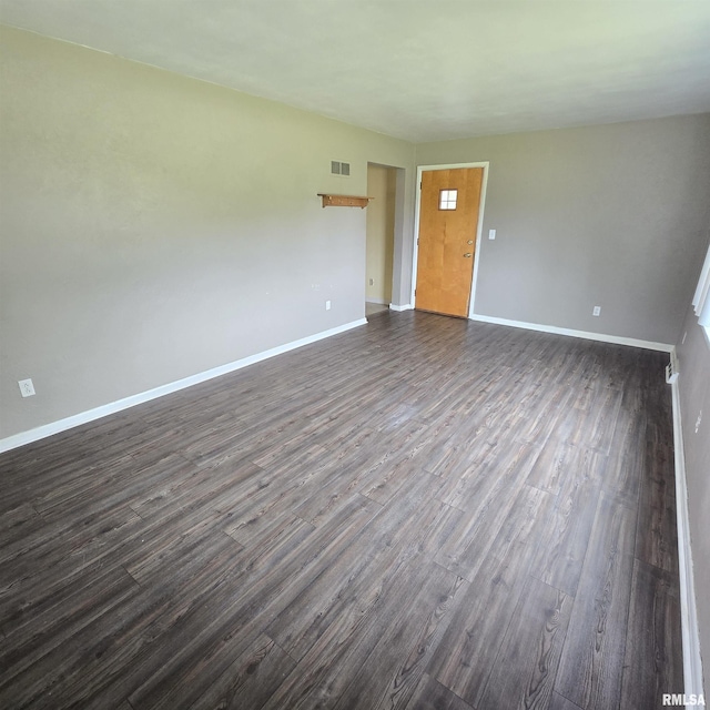 4928 W Farmington Rd, Peoria, IL 61604 - unfurnished room with baseboards and dark wood-style floors