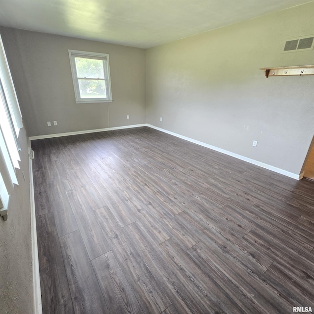 4928 W Farmington Rd, Peoria, IL 61604 - unfurnished room with dark wood-style flooring and baseboards