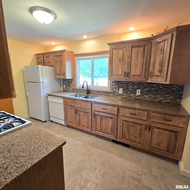 4928 W Farmington Rd, Peoria, IL 61604 - kitchen with white appliances, a sink, tasteful backsplash, dark stone counters, and recessed lighting
