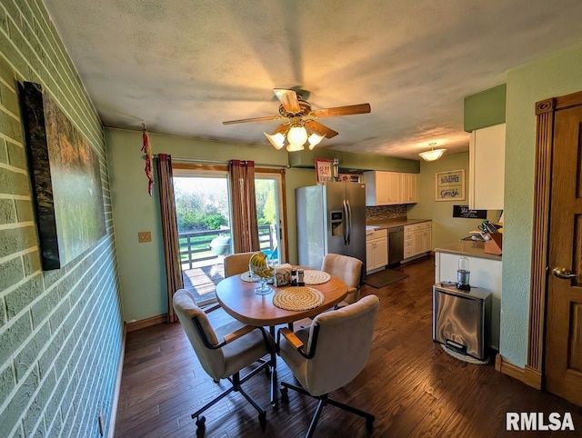 2123 Highwood Ave, Pekin, IL 61554 - dining area featuring dark wood-style floors, ceiling fan, and baseboards