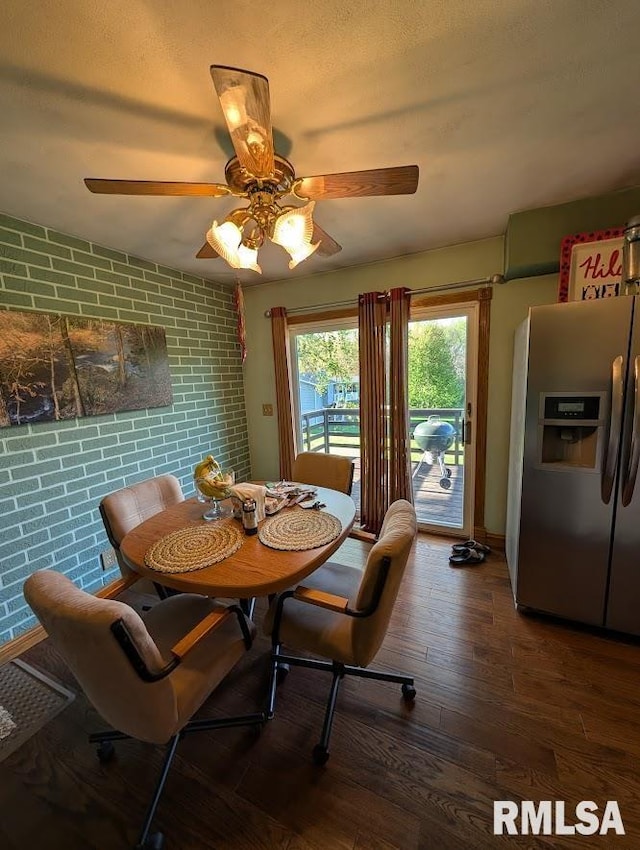 2123 Highwood Ave, Pekin, IL 61554 - dining area featuring ceiling fan, hardwood / wood-style flooring, and brick wall