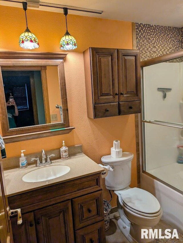 2123 Highwood Ave, Pekin, IL 61554 - bathroom with vanity, toilet, and shower / tub combination