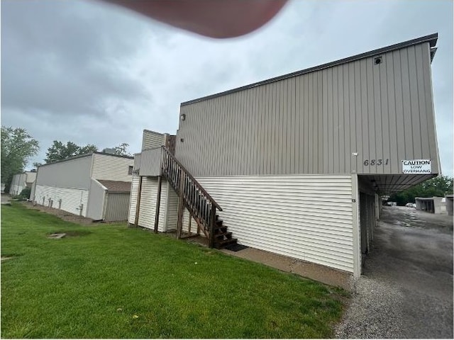 6831 N Frostwood Pkwy Unit D29, Peoria, IL 61615 - view of property exterior featuring stairway and a yard