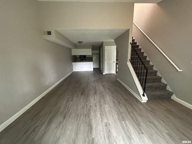6831 N Frostwood Pkwy Unit D29, Peoria, IL 61615 - foyer entrance with baseboards, dark wood-type flooring, and stairs