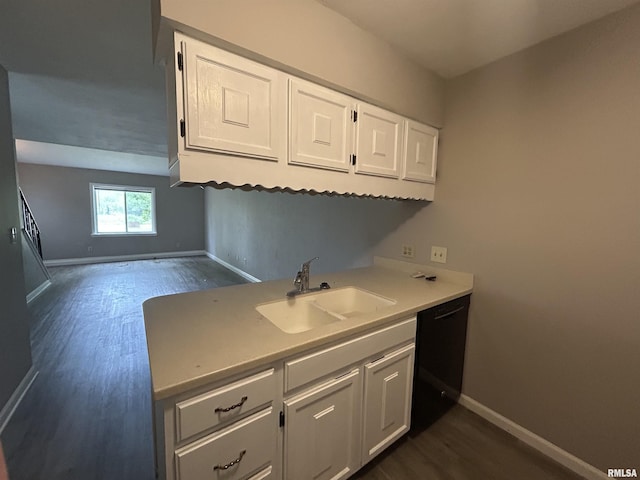6831 N Frostwood Pkwy Unit D29, Peoria, IL 61615 - kitchen with a sink, baseboards, dark wood-style floors, and white cabinets