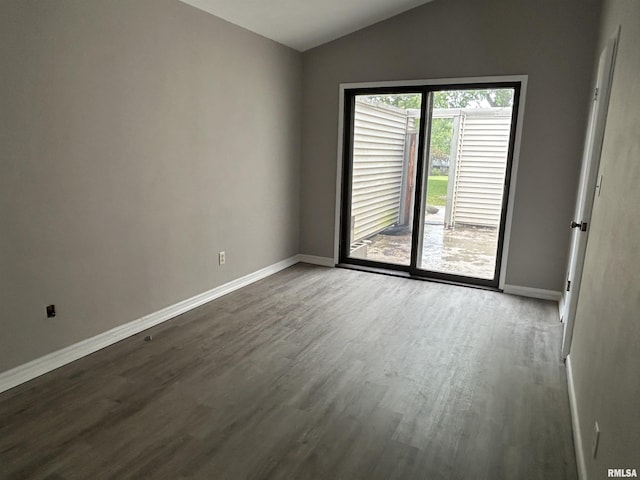 6831 N Frostwood Pkwy Unit D29, Peoria, IL 61615 - unfurnished room featuring dark wood-style floors, baseboards, and vaulted ceiling