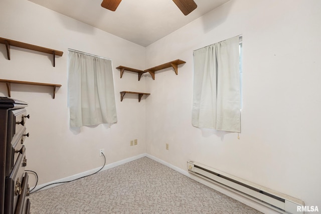 1111 S 4th St, Pekin, IL 61554 - carpeted empty room featuring a baseboard radiator, a ceiling fan, and baseboards