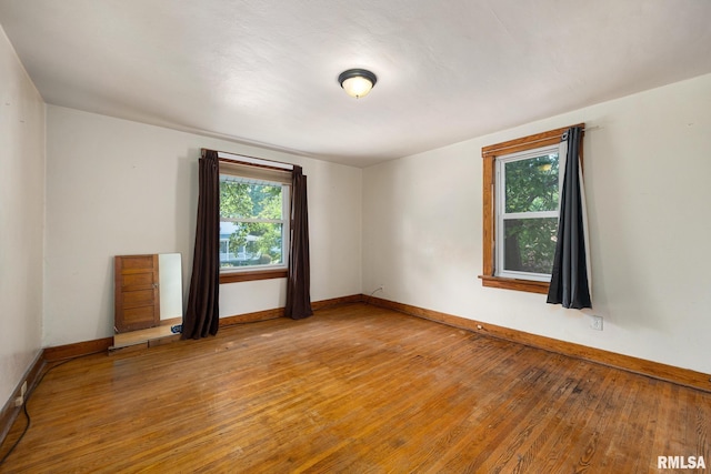 1111 S 4th St, Pekin, IL 61554 - spare room featuring light wood-type flooring and baseboards