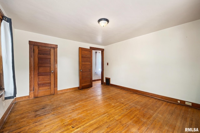 1111 S 4th St, Pekin, IL 61554 - unfurnished room featuring light wood-type flooring and baseboards
