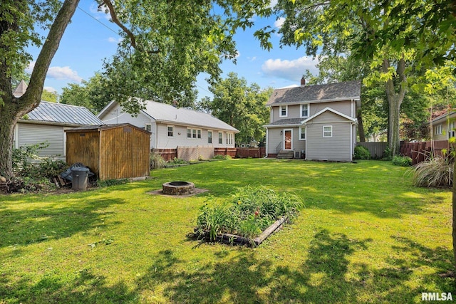 1111 S 4th St, Pekin, IL 61554 - view of yard featuring a fire pit and entry steps