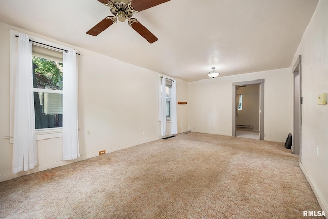 1111 S 4th St, Pekin, IL 61554 - carpeted empty room featuring a ceiling fan, baseboard heating, and baseboards
