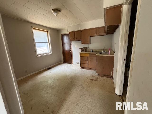 907 E Republic St, Peoria, IL 61603 - kitchen with brown cabinets and light countertops