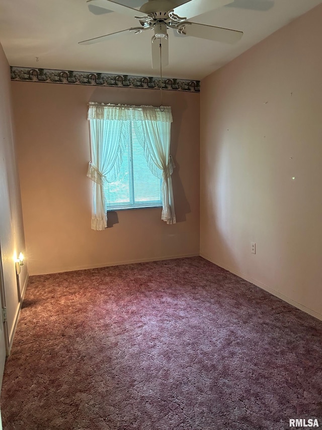 1407 Lincoln St, Pekin, IL 61554 - carpeted empty room with a ceiling fan