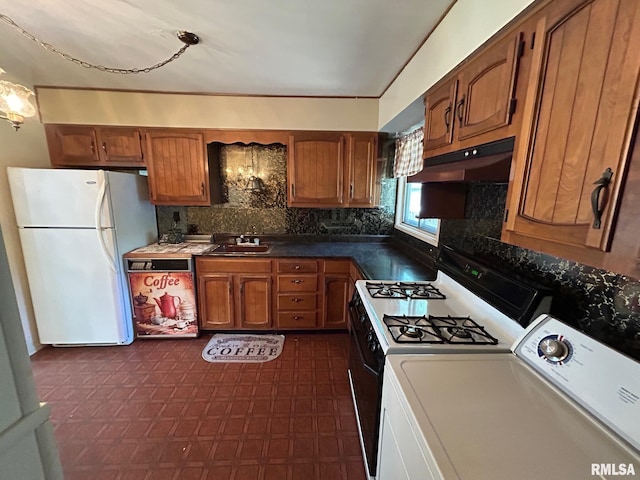 1407 Lincoln St, Pekin, IL 61554 - kitchen featuring washer / clothes dryer, freestanding refrigerator, under cabinet range hood, and brown cabinets
