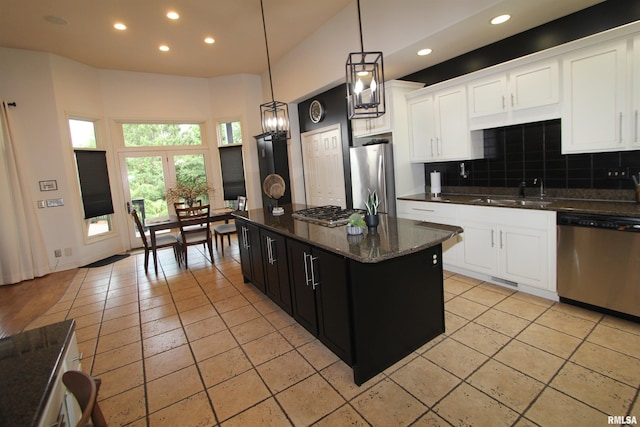 1964 Chestnut Ln, Washington, IL 61571 - kitchen featuring appliances with stainless steel finishes, recessed lighting, backsplash, white cabinets, and hanging light fixtures