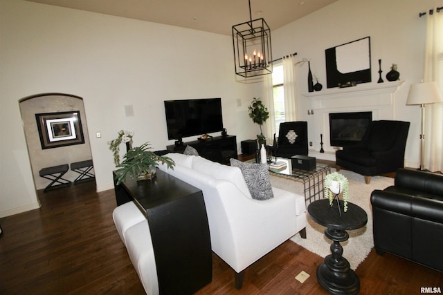 1964 Chestnut Ln, Washington, IL 61571 - living area featuring dark wood-type flooring, a glass covered fireplace, and a chandelier