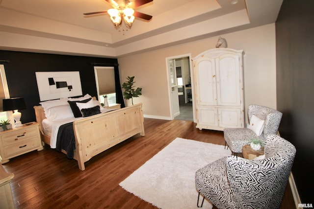 1964 Chestnut Ln, Washington, IL 61571 - bedroom featuring a tray ceiling, dark wood-style flooring, and ceiling fan