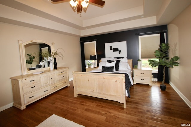 1964 Chestnut Ln, Washington, IL 61571 - bedroom with a raised ceiling, dark wood finished floors, and a ceiling fan