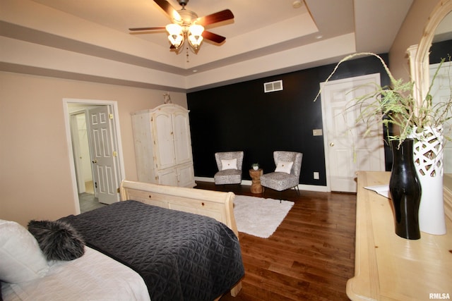 1964 Chestnut Ln, Washington, IL 61571 - bedroom featuring a tray ceiling, wood finished floors, and a ceiling fan