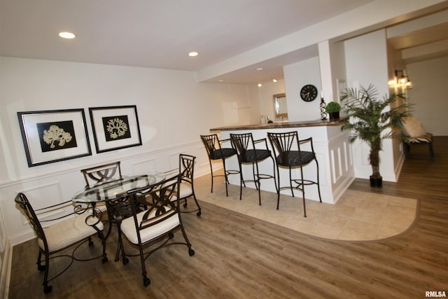 1964 Chestnut Ln, Washington, IL 61571 - dining room featuring a decorative wall, wood finished floors, recessed lighting, and a wainscoted wall