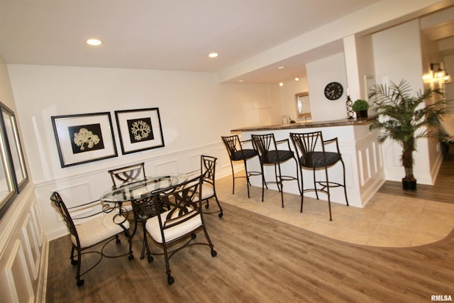 1964 Chestnut Ln, Washington, IL 61571 - dining space with a decorative wall, wood finished floors, recessed lighting, and a wainscoted wall