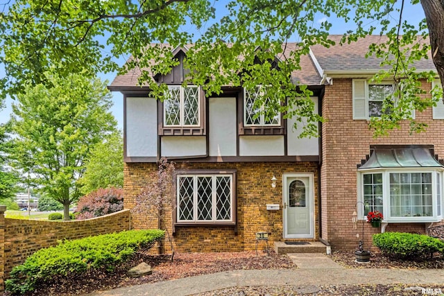 1461 Valle Vista Blvd Unit 30, Pekin, IL 61554 - tudor home with brick siding, stucco siding, and a shingled roof