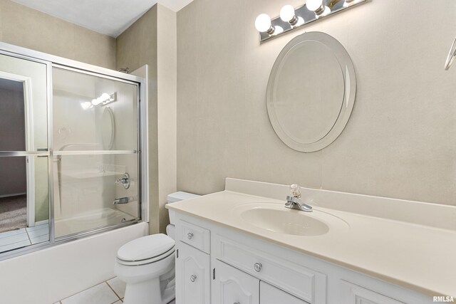 1461 Valle Vista Blvd Unit 30, Pekin, IL 61554 - full bath with vanity, toilet, enclosed tub / shower combo, and tile patterned flooring