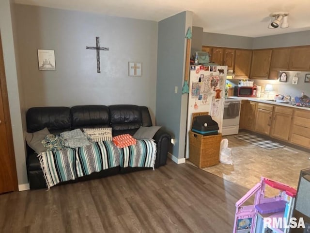 102 Main St, Camp Grove, IL 61424 - living area with wood finished floors and baseboards
