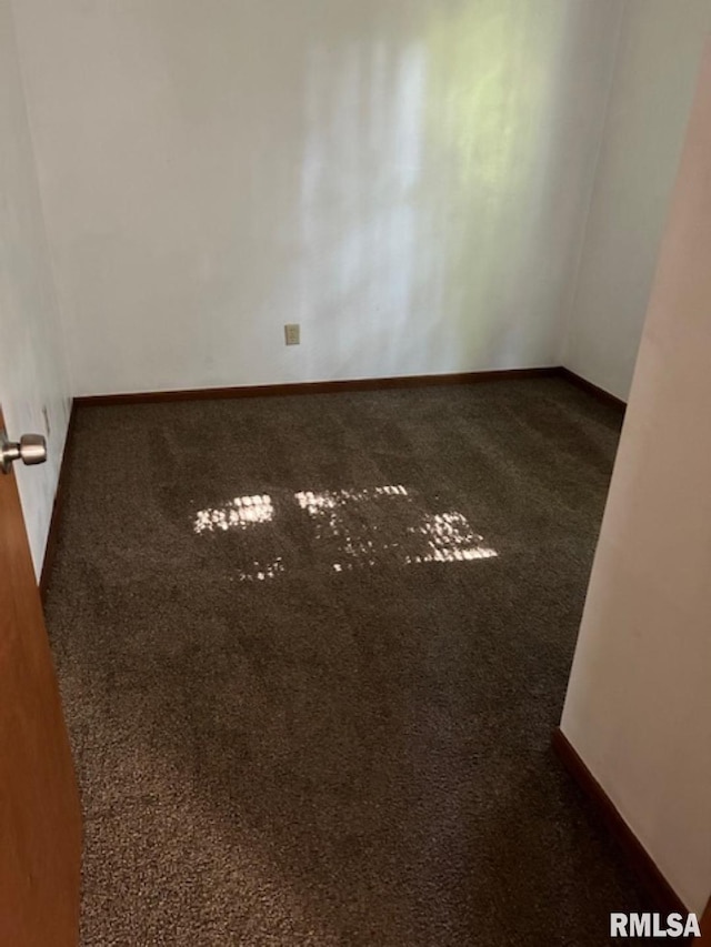 102 Main St, Camp Grove, IL 61424 - carpeted empty room with baseboards