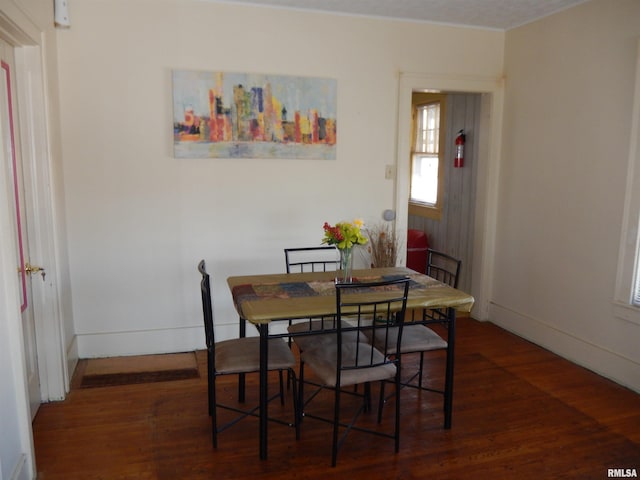 120 W Adams St, Macomb, IL 61455 - dining area featuring wood finished floors and baseboards