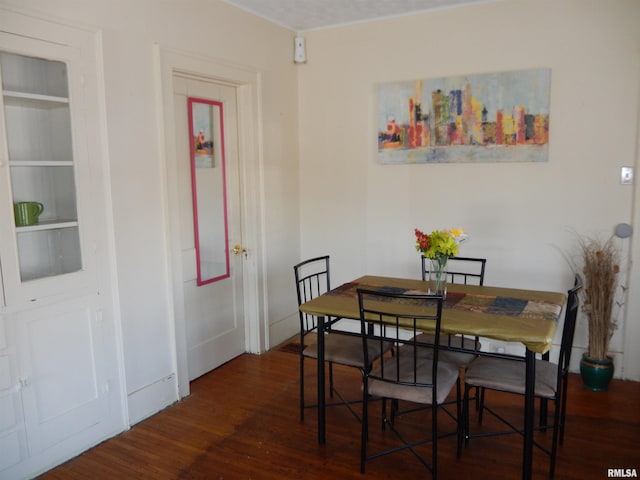 120 W Adams St, Macomb, IL 61455 - dining space with wood finished floors and baseboards