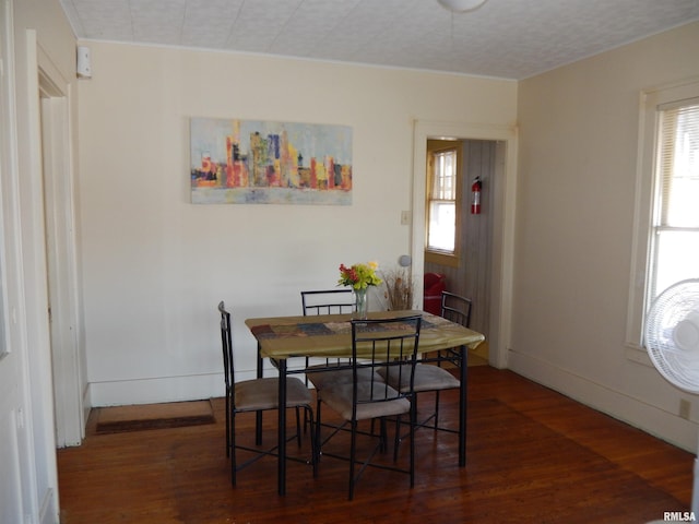 120 W Adams St, Macomb, IL 61455 - dining space featuring healthy amount of natural light and wood finished floors