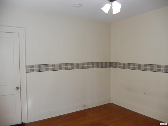 120 W Adams St, Macomb, IL 61455 - spare room with a smoke detector and dark wood-type flooring