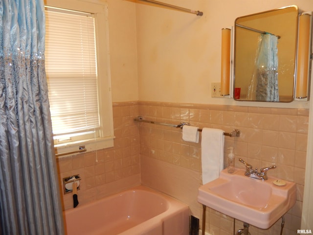 120 W Adams St, Macomb, IL 61455 - full bathroom featuring a garden tub, a sink, and tile walls