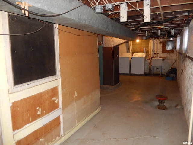 120 W Adams St, Macomb, IL 61455 - unfinished basement with washer and clothes dryer, electric panel, and a sink