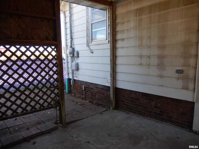 120 W Adams St, Macomb, IL 61455 - property entrance featuring crawl space and a patio