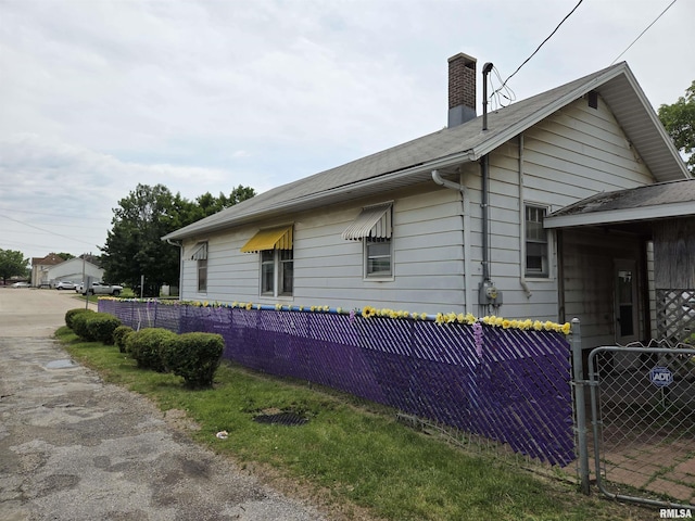 120 W Adams St, Macomb, IL 61455 - view of side of home with a chimney