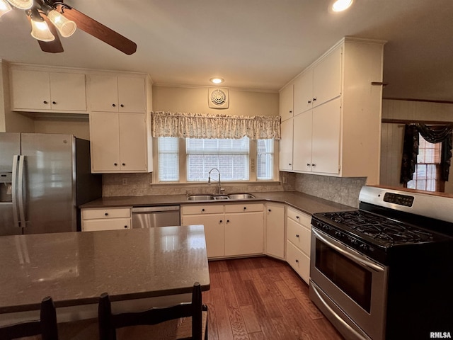 360 N Normal St, Macomb, IL 61455 - kitchen featuring stainless steel appliances, recessed lighting, dark wood finished floors, decorative backsplash, and ceiling fan