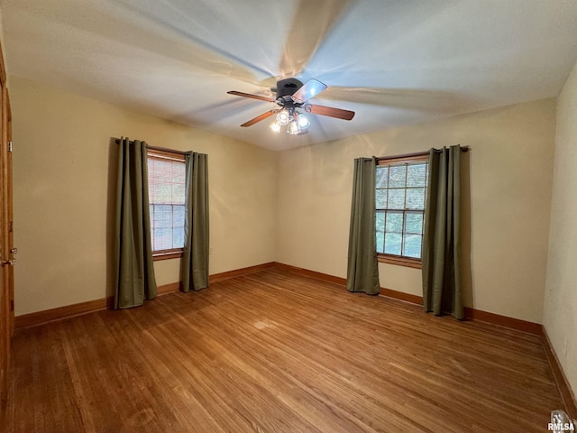 360 N Normal St, Macomb, IL 61455 - unfurnished room with light wood finished floors and ceiling fan