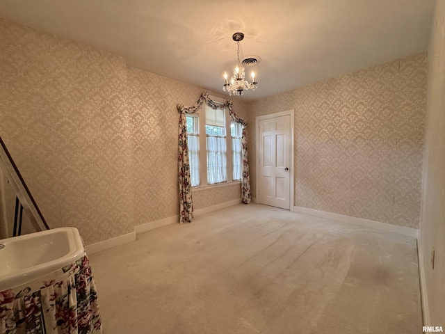 360 N Normal St, Macomb, IL 61455 - carpeted spare room featuring a chandelier and wallpapered walls