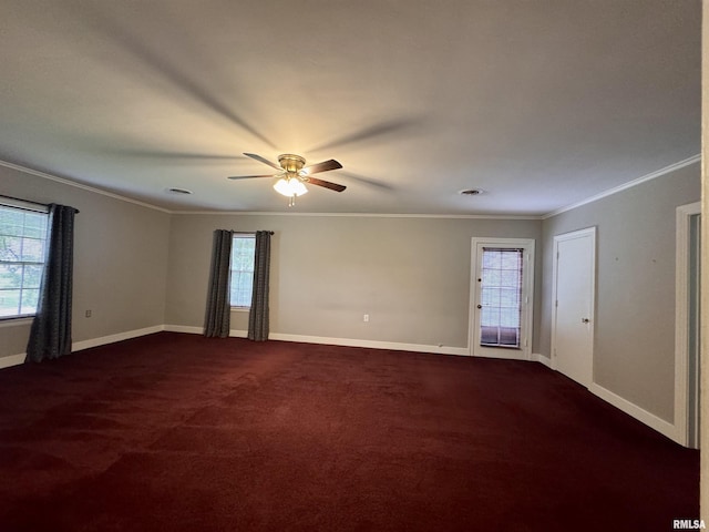 360 N Normal St, Macomb, IL 61455 - empty room featuring healthy amount of natural light, ornamental molding, dark colored carpet, and a ceiling fan