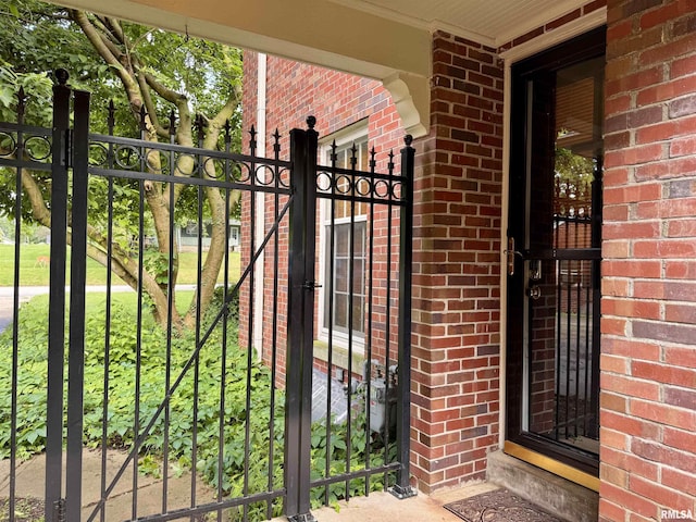 360 N Normal St, Macomb, IL 61455 - entrance to property featuring brick siding and a gate