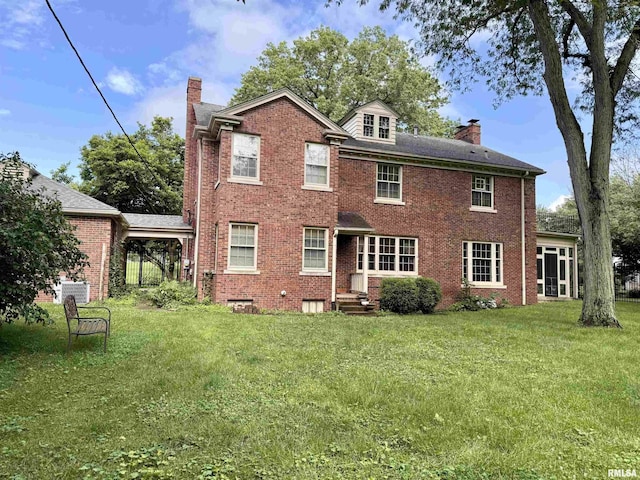 360 N Normal St, Macomb, IL 61455 - rear view of property featuring a chimney, a yard, and brick siding
